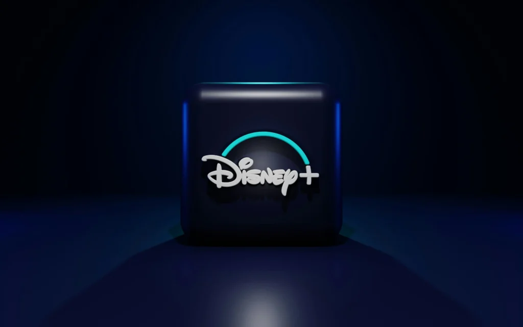 Símbolo do Disney+. É uma caixa preta com o logo do Disney+ em branco no meio.